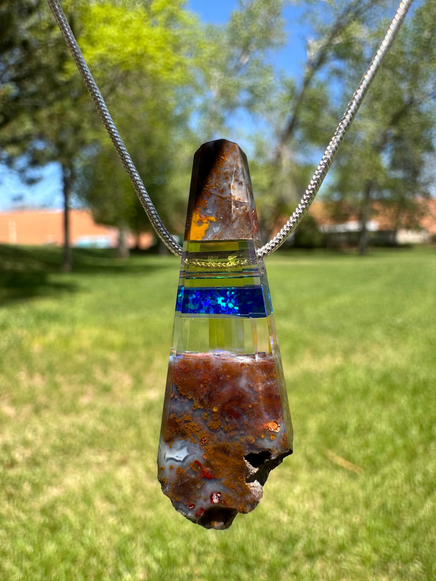“Raw” rock pendant with blue opal and dichroic glass