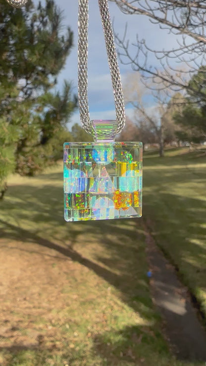 Dichroic glass pendant with nine opals